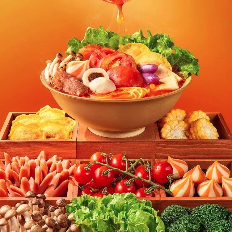 Super Veggie Combo features a bowl of spicy broth - based hot pot with noodles, assorted vegetables like tomatoes, corn, mushrooms, lettuce, and purple potatoes, along with meat at YGF Malatang, a Chinese restaurant in Daly City